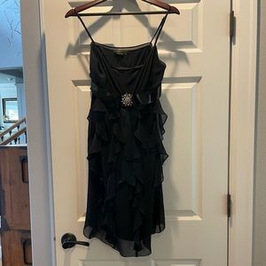 BCBG black cocktail dress with diamond brooch